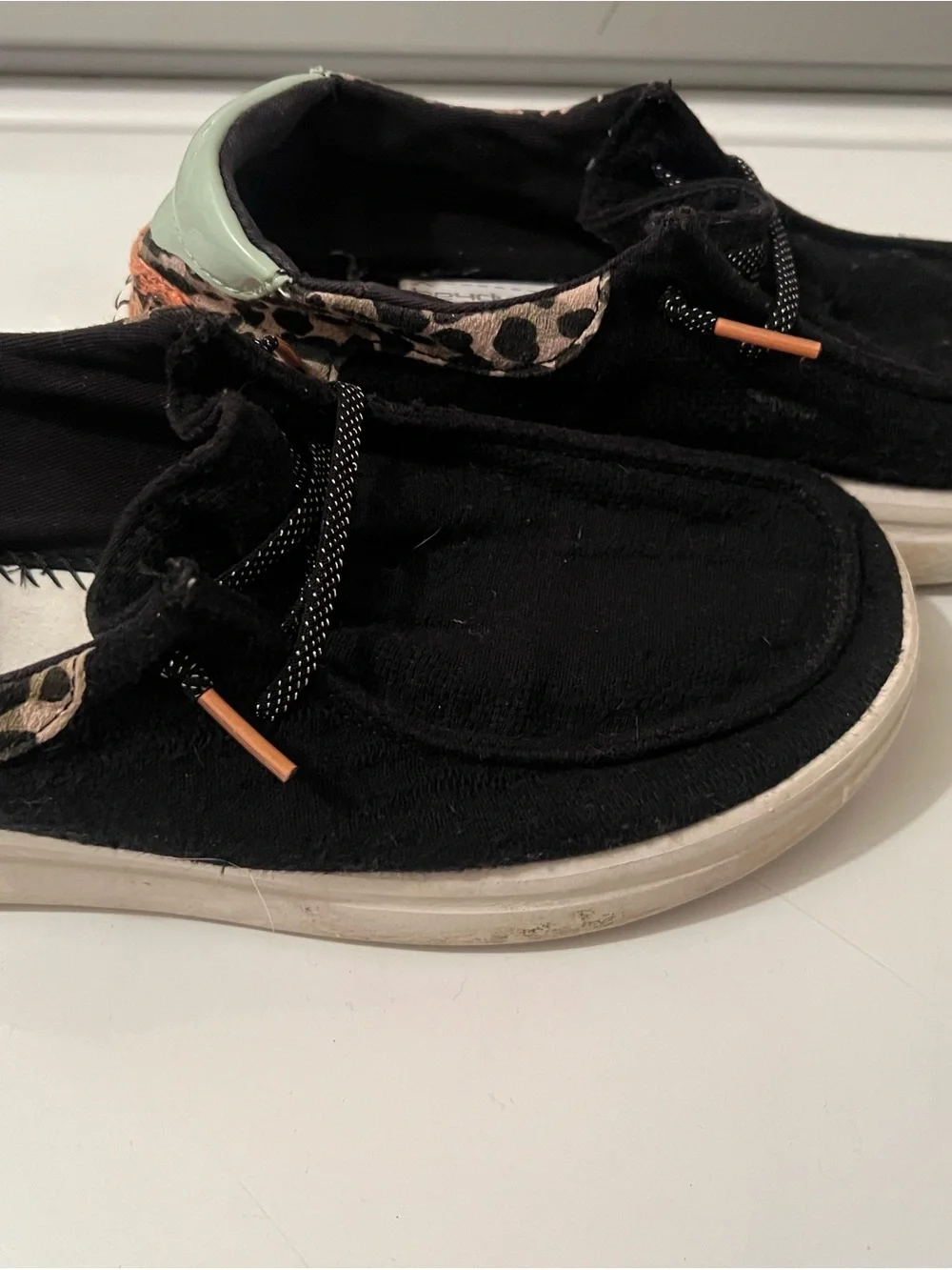 Hey Dude Black Slip-On Sneakers with Leopard Trim and Mint Heel